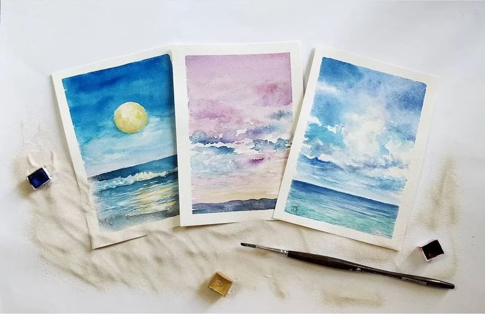 Tre acquerelli di cielo e mare: luna, tramonto, nuvole